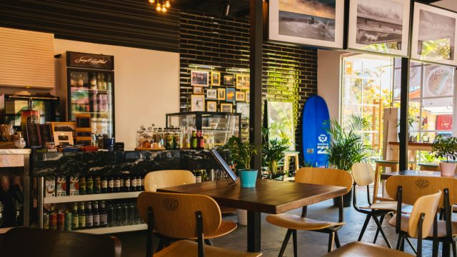 Stylish café interior with modern decor and natural lighting, located in Sochi, Russia.